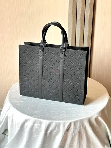 Black Louis Vuitton embossed leather tote bag