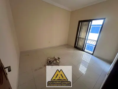 A well-located apartment in Al Nuaimiya 1, close to Al Hikmah School and Al Nuaimiya Towers, featuring a balcony, central AC, two bathrooms, and free