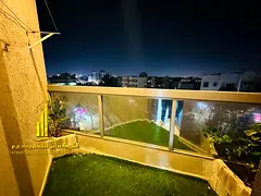 A luxurious, fully furnished 2-bedroom apartment with a living room available for monthly rent in Al
