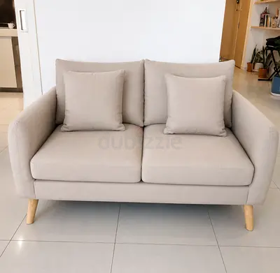 Home Center Compact 2-Seater Beige Fabric Sofa with Wooden Legs