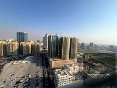 Elegant 2BHK apartment in Al Waha Towers, Ajman, featuring 2 bathrooms, spacious layout, central A/C
