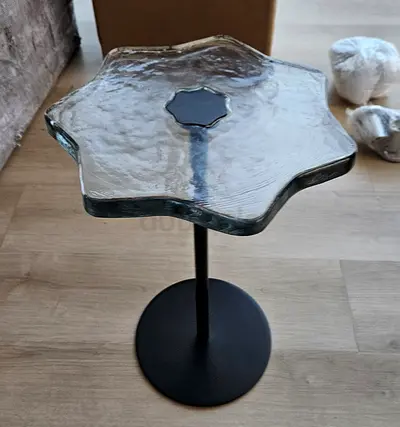 Unique star-shaped textured glass side table on black pedestal base bought in Dubai Mall