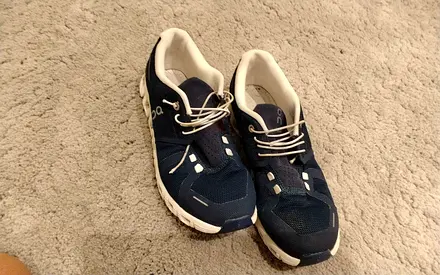 Used navy blue athletic sneakers, size unknown, good condition