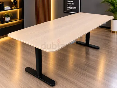 Large electric height-adjustable conference table - light wood top, black legs