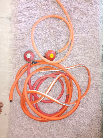 Used LPG gas hose and regulator set (orange) - good working condition