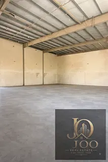 8000 sqft warehouse UAQ mezzanine 100KW AED 310K two main roads offices ready