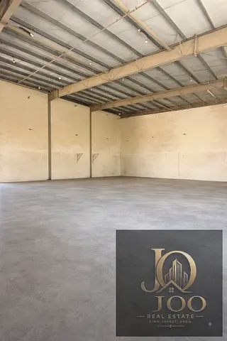 8000 sqft warehouse UAQ mezzanine 100KW AED 310K two main roads offices ready