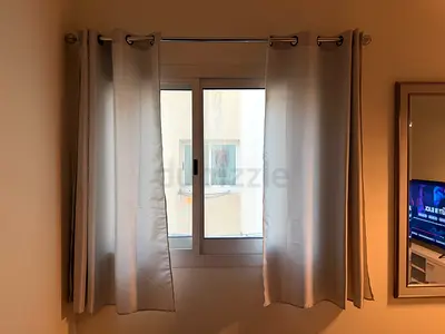 Light grey eyelet curtains (pair) with Curtain rod - Good condition