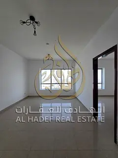 Master bedroom + living room + free parking + prime location on Al Wahda Street — available for an