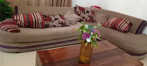 5 seater beige fabric sofa with patterned cushions - good condition