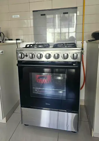 Stainless Steel 4-Burner Gas Cooker with Oven - Good Working Condition