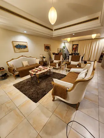 Classic beige and gold living room sofa set with armchairs and coffee table