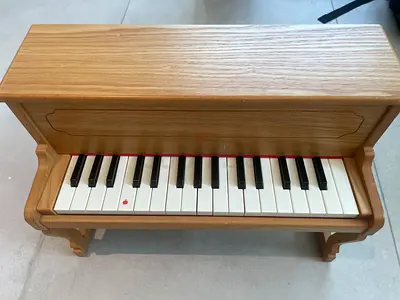 Small wooden toy piano, good condition