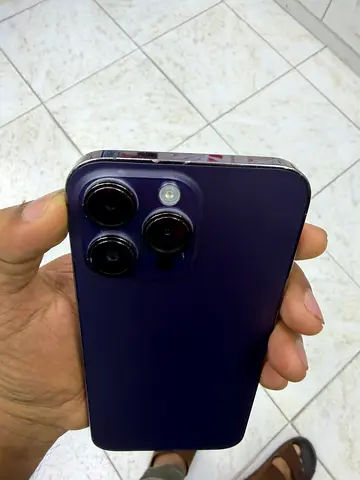 Used iPhone-style smartphone with triple camera - good condition