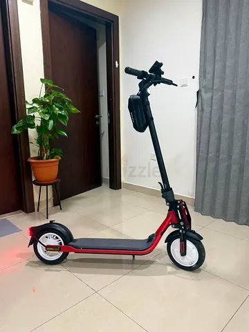 Red and Black Electric Scooter with Storage Bag