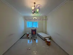 Two-bedroom apartment with a living room for annual rent in Al Majaz 2 Free parking Spacious layout