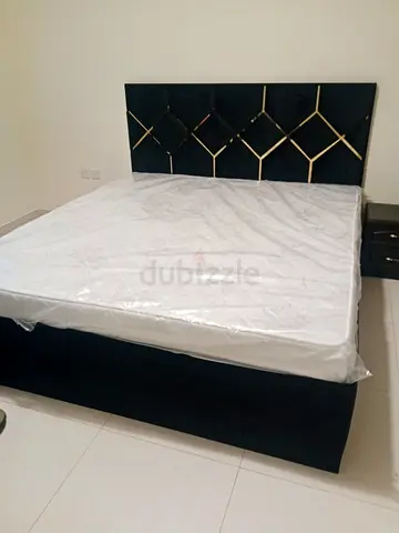 Queen size upholstered bed with geometric headboard