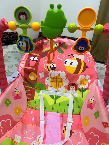 Pink Floral Baby Bouncer Seat with Hanging Toys - Good Condition