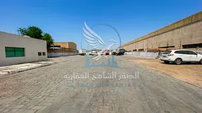 15,000 sq ft yard for rent in Industrial Area 10, Sharjah, on a main road, with 2 offices, 2 bathroo