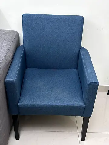Blue fabric armchair with wooden legs - good condition