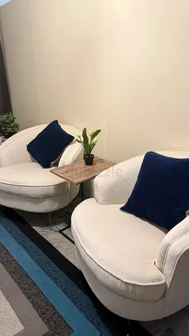 An almost brand new off white sofa for sale
