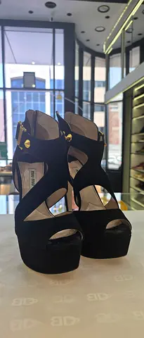 Black suede platform heels by Miu Miu, size likely EU 38