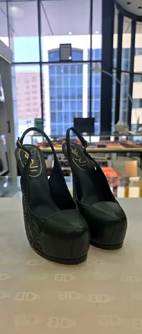 Black leather high heel platform pumps - size not specified