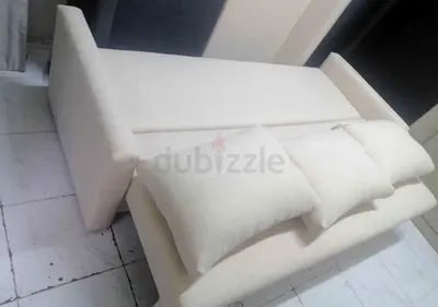 Modern Cream Fabric Sofa Bed with Three Throw Pillows