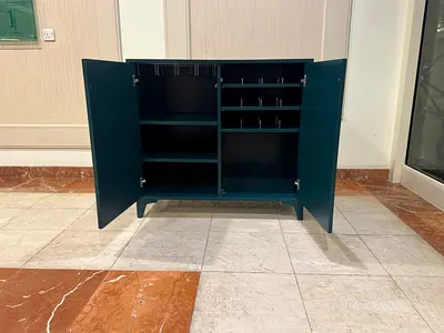 Compact Dark Teal Storage Cabinet with Multiple Shelves and Wine Rack