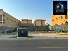 Residential plot of land for sale, 10,000 square feet, located directly in front of the mosque in a 