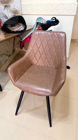Brown faux leather dining table with 6 chair with quilted back