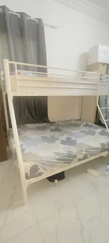 White metal bunk bed with ladder — double bottom, single top, good condition