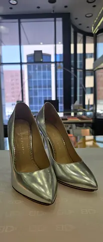Silver metallic women's high heels - size not specified, gently used