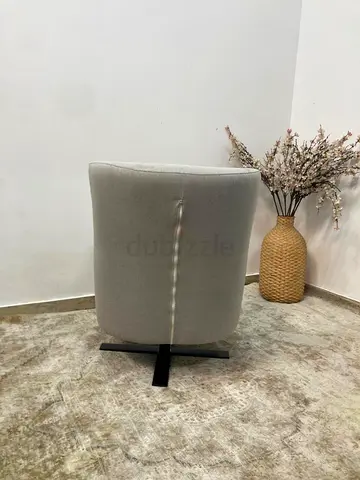 Upholstered swivel arm chair
