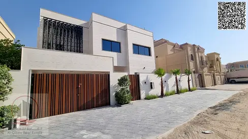 Villa for sale in Al Rawda 1, Ajman: 5 master bedrooms, majlis, living room, maid's room & pool. Fr
