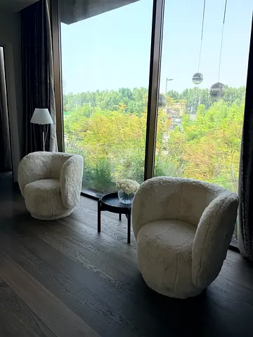 Set of 2 cozy white plush swivel lounge chairs - good condition