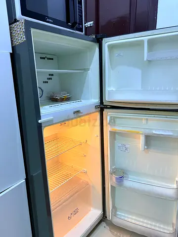 Used double-door refrigerator with top freezer - good working condition