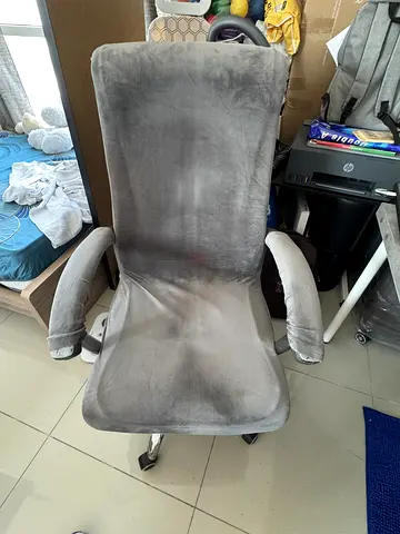 Grey high-back office swivel chair with armrests - used