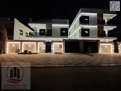 Villa for sale in Al Aliya, Ajman: 7 master bedrooms, majlis, living room, maid’s room & elevator. Freehold, financing, AC, electricity & water incl.