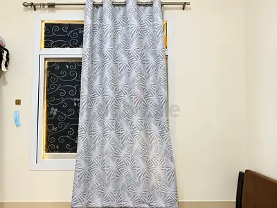 Grey patterned eyelet curtains - single panel, gently used