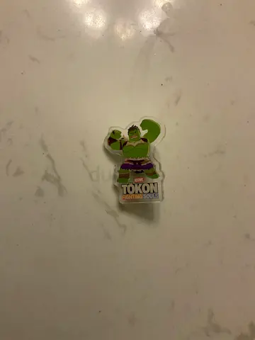 Exclusive marvel token pin
