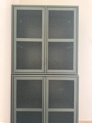 Metal storage cabinet with perforated mesh door - sturdy and functional floor and wall