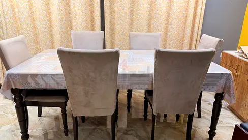 Solid wood dining table with 6 upholstered chairs - good condition