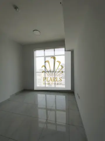 Great first-row 2BR apartment on Ajman Corniche with open view, 2 baths, balcony, wardrobes, central A/C. AED 45K, 4 payments, AED 3K cash deposit now