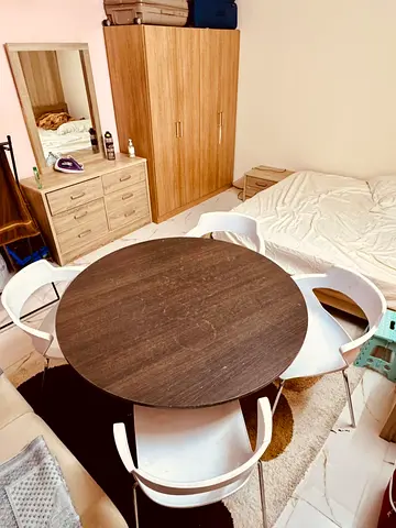 Round dining table with 4 chairs - dark wood finish