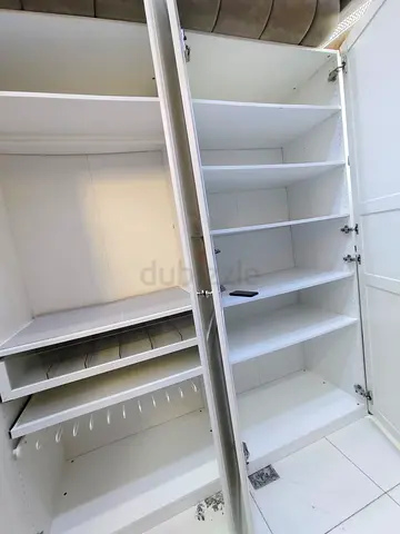 White built-in wardrobe / closet with adjustable shelves