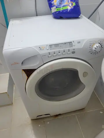 Used front-load washing machine - needs repair (rust at base)