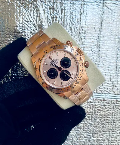 Rolex Cosmograph Daytona crafted in 18ct Everose gold with a distinctive sundust and black sub-dial