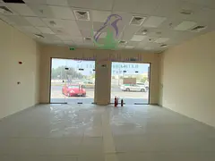 Commercial Shop for Rent in Al Majaz 3 on Al Khalidiyah Street 540 Sq Ft Glass Front Fully Finished 