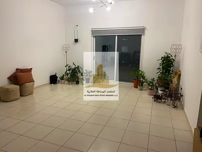 One-bedroom apartment with a living room for rent in Al palm Tower 1 full view of Al Mamzar